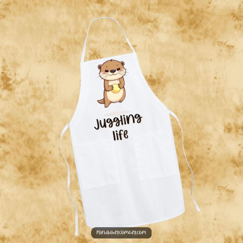 Funny apron showing a happy otter balancing a glowing orb on its nose while cooking, a hilarious kitchen accessory.