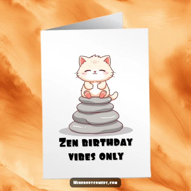 Funny Free Printable Birthday Card: Fluffy cat meditates serenely atop stacked stones, radiating peace.