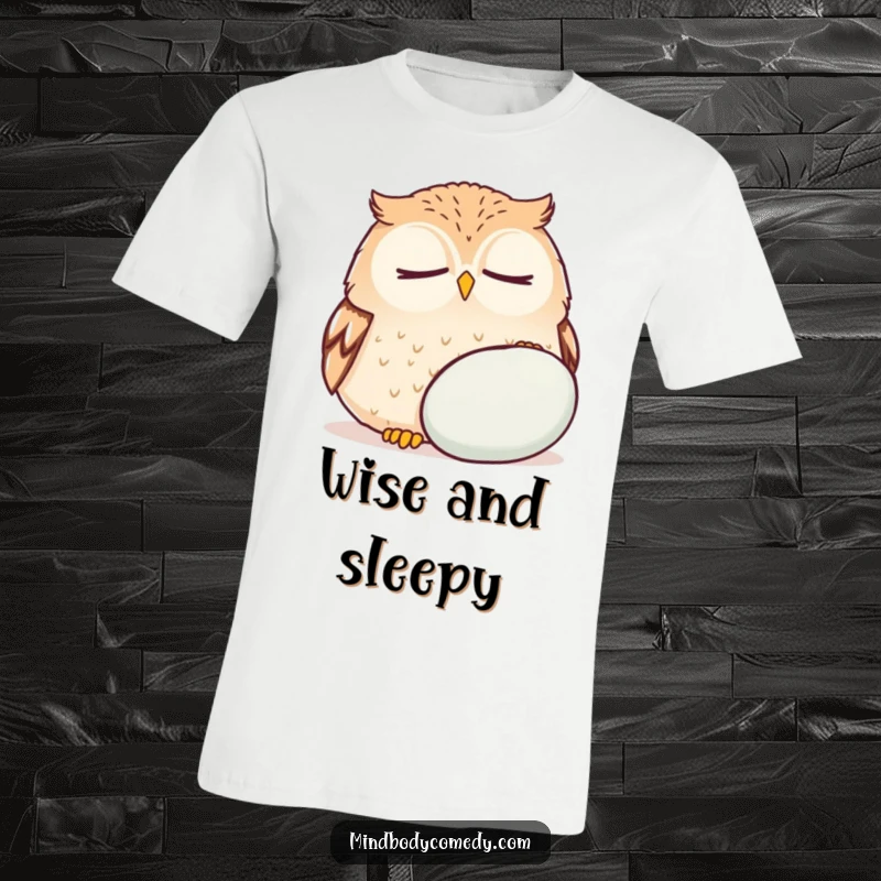 Funny round owl breathing deeply near a cushion, embodying calm on a relaxed humorous t-shirt.